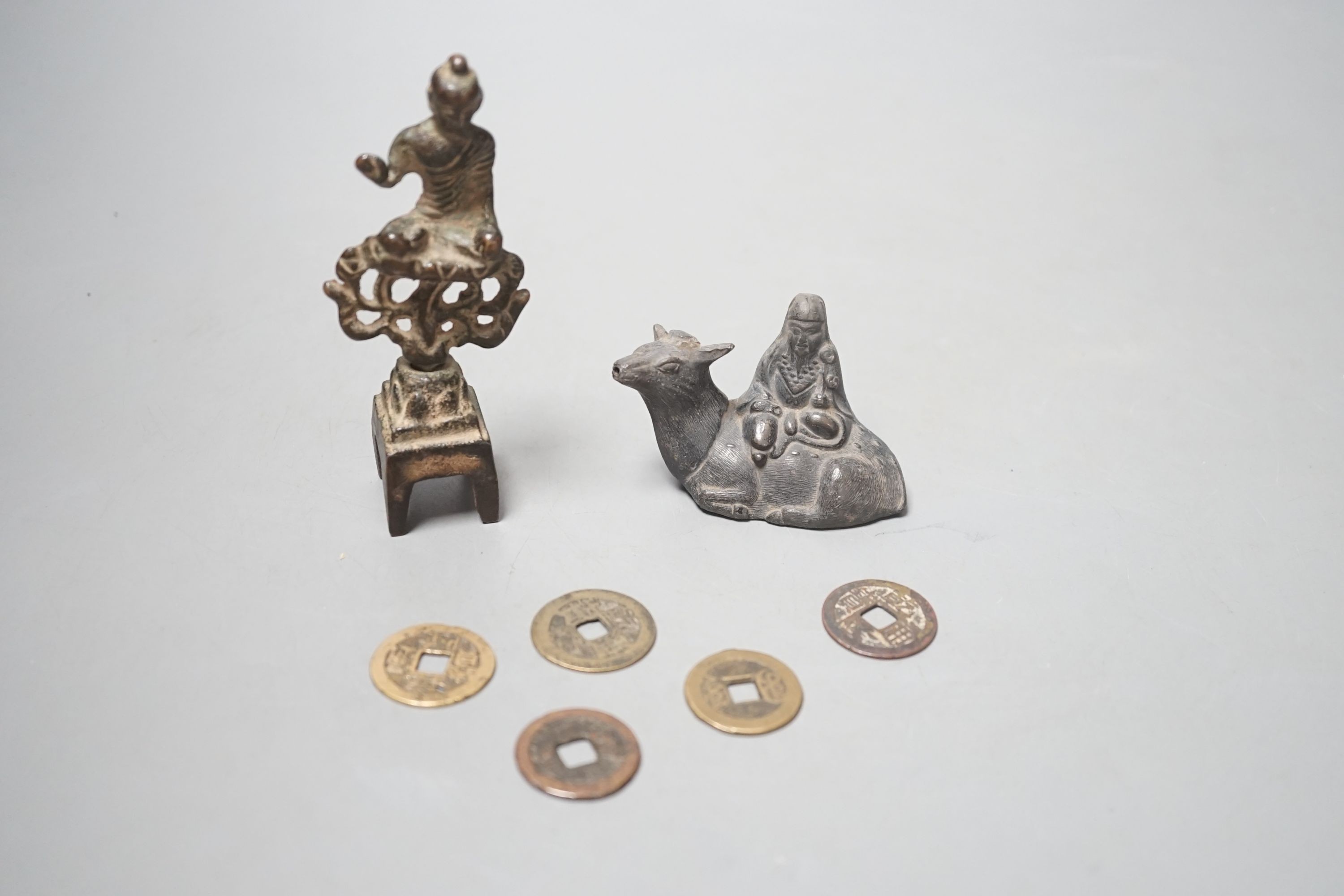 A collection of Chinese coins, together with a water dipper in the form is a seated animal, and a seated Buddha (7)